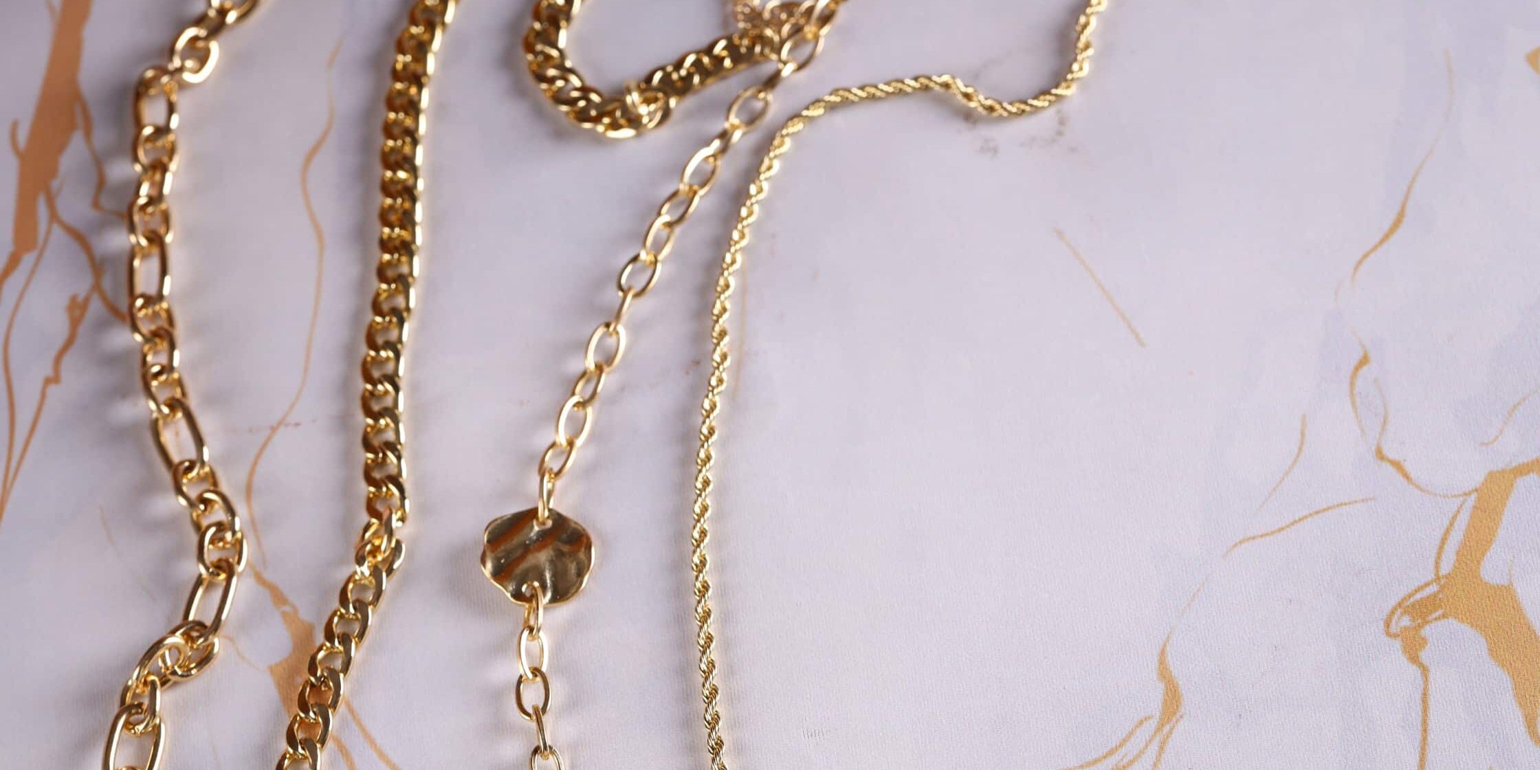 gold jewelry chain necklace on background